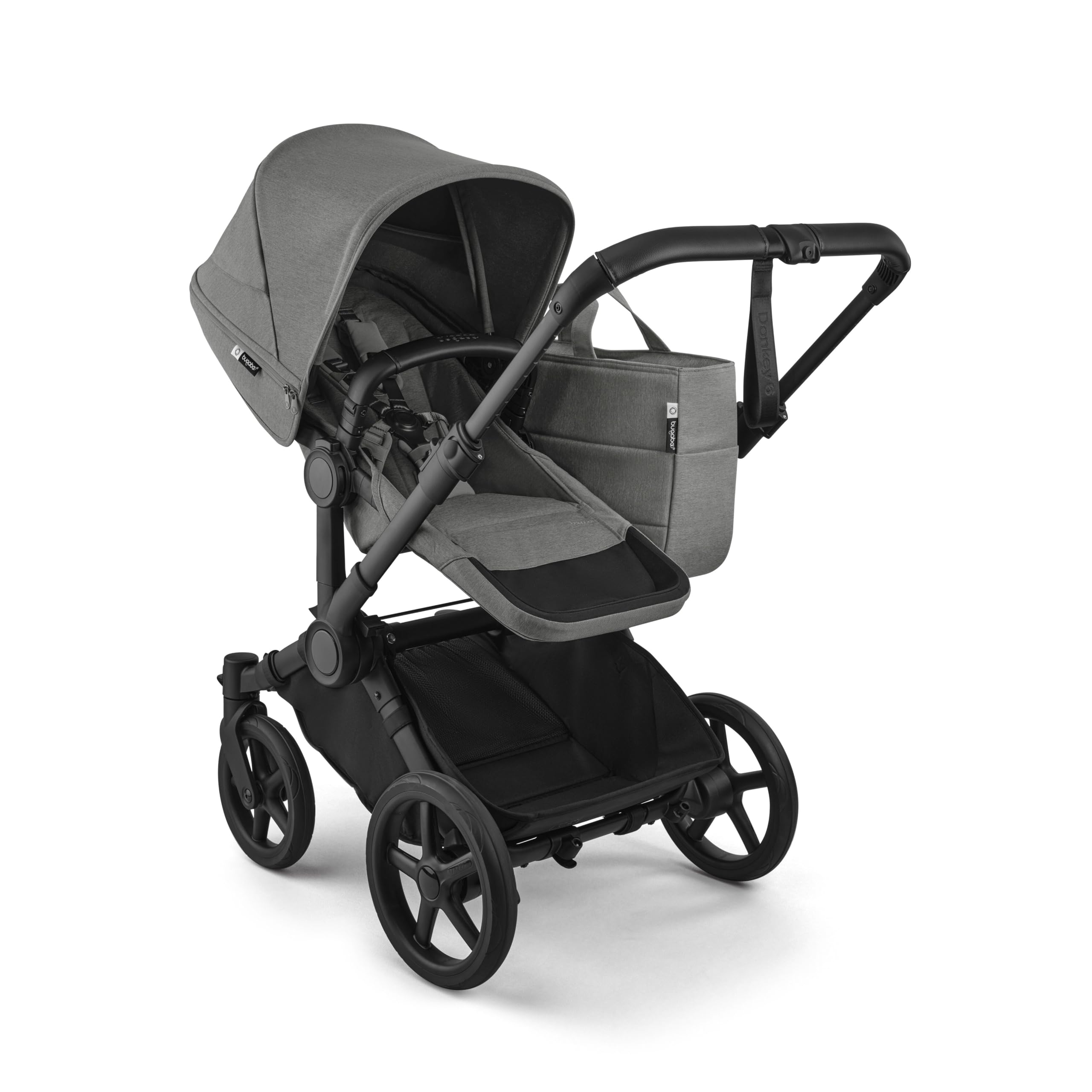 Bugaboo Donkey 6 single-to-double all-terrain stroller in cocoa brown with adjustable seats for newborn and toddler.