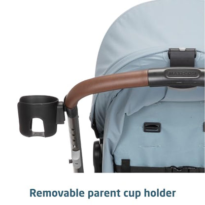 Maxi-Cosi Zelia Luxe 5-in-1 modular travel system with stroller and car seat, featuring adjustable handle and stylish design.