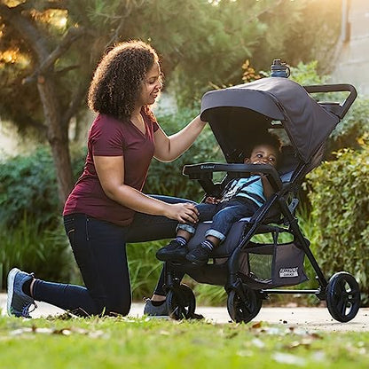 Baby Trend Passport Cargo stroller travel system with pink bamboo EZ-Lift infant car seat and adjustable handlebar.
