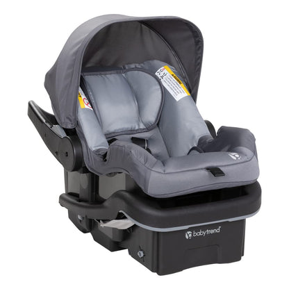 Baby Trend Passport cargo stroller with pink bamboo fabric and EZ-Lift infant car seat, showcasing a compact travel system for babies.