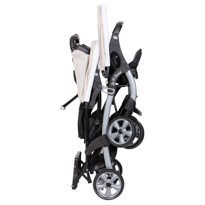 Baby Trend Stormy double stroller and car seat travel system with tandem design, lightweight and portable for infants and toddlers.