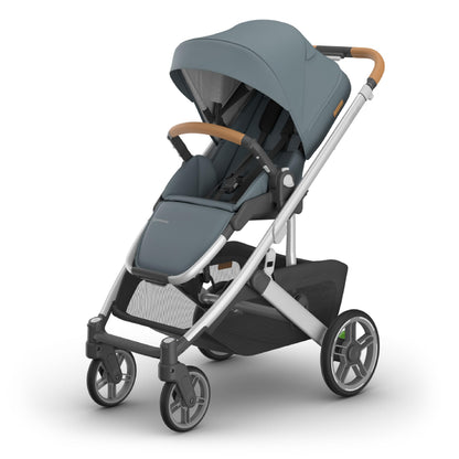 UPPAbaby Cruz V3 stroller with reversible seat, infant insert, and weather shields in Greyson (Charcoal Mélange) with carbon frame and saddle leather.